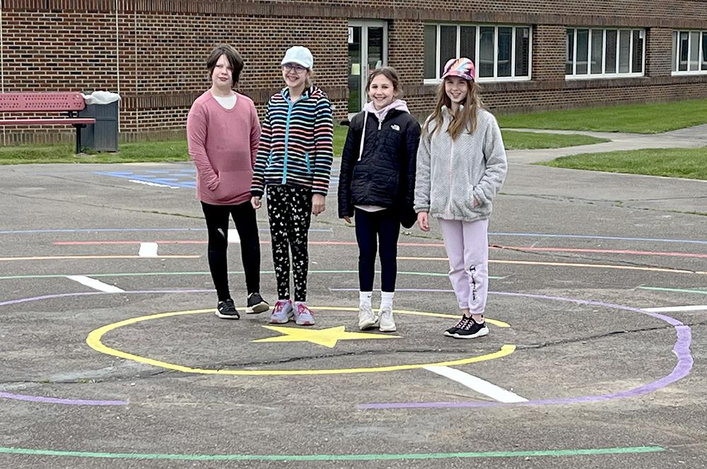Members of Girl Scout Troop 28850 Katie Wyman, Grace Carnicelli, Elise Balazs, Jill Julian and (not pictured) Nina Szudera completed a community service project, painted games on the Mars Area Primary Center playground. 